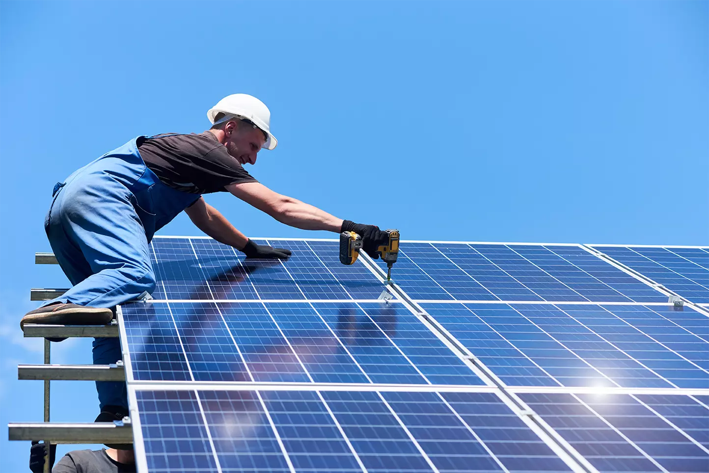 solar energy man installing solar panels in San Diego, CA